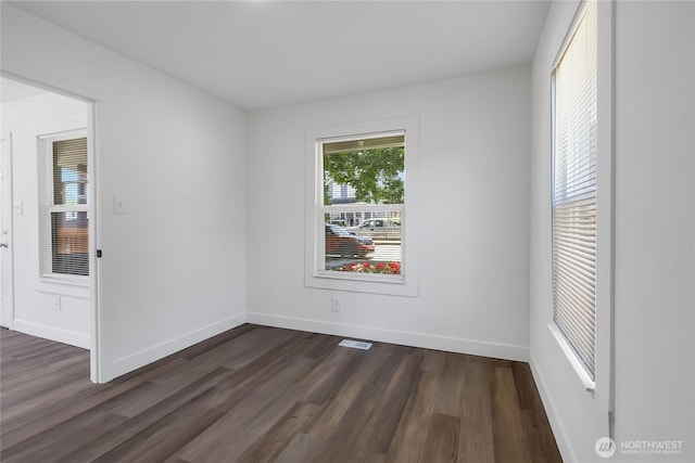 1433 E 32nd St, Tacoma, WA 98404 - unfurnished room featuring dark wood-style flooring and baseboards