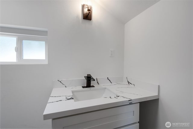 1433 E 32nd St, Tacoma, WA 98404 - bathroom featuring vaulted ceiling and vanity