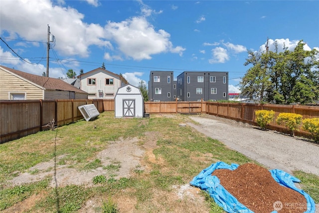 1433 E 32nd St, Tacoma, WA 98404 - fenced backyard with a storage unit