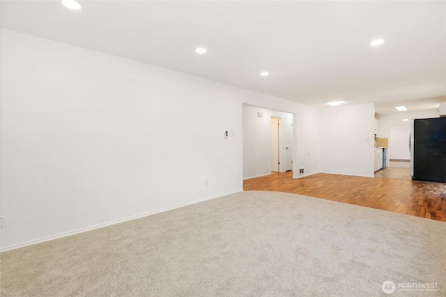 16548 115th Ave SE, Renton, WA 98055 - spare room featuring light colored carpet and recessed lighting