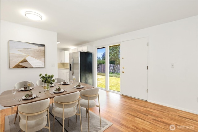 16548 115th Ave SE, Renton, WA 98055 - dining space featuring light wood-style flooring and baseboards