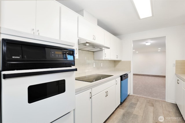 16548 115th Ave SE, Renton, WA 98055 - kitchen with oven, dishwasher, black electric cooktop, light wood-style flooring, and under cabinet range hood
