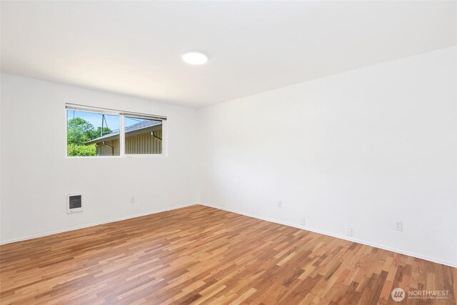 16548 115th Ave SE, Renton, WA 98055 - unfurnished room with light wood-style floors