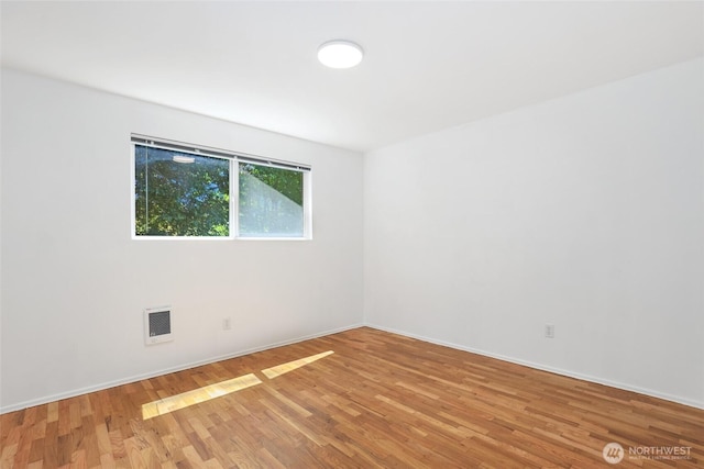 16548 115th Ave SE, Renton, WA 98055 - spare room with light wood-style floors and baseboards