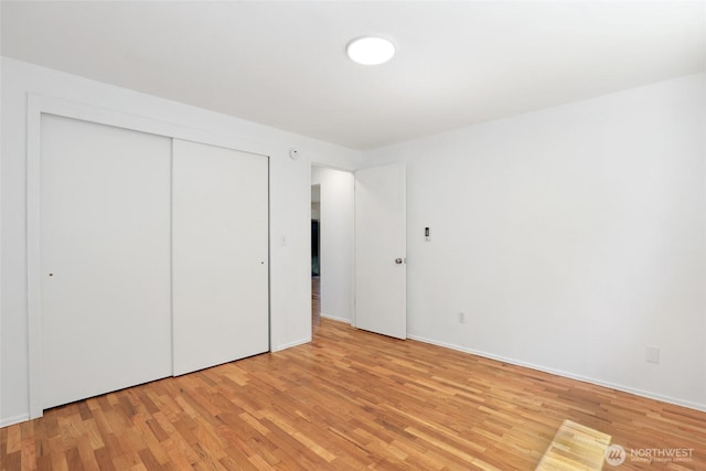16548 115th Ave SE, Renton, WA 98055 - unfurnished bedroom featuring light wood finished floors and a closet
