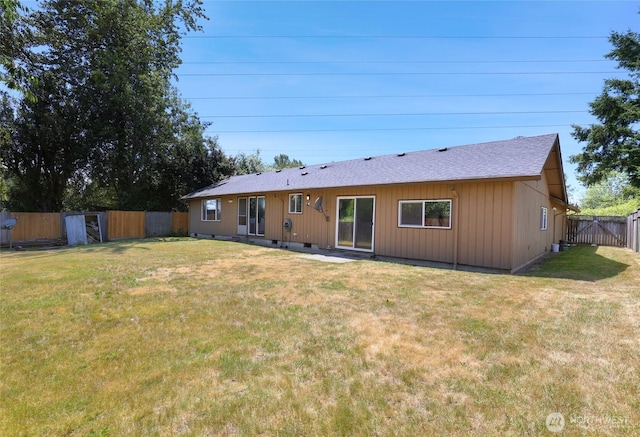 16548 115th Ave SE, Renton, WA 98055 - rear view of property featuring a fenced backyard and a shingled roof