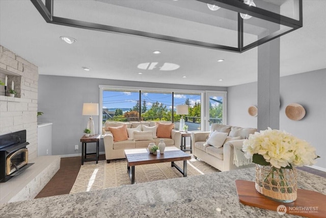 619 8th Ave S, Edmonds, WA 98020 - living room featuring plenty of natural light, a wood stove, and recessed lighting