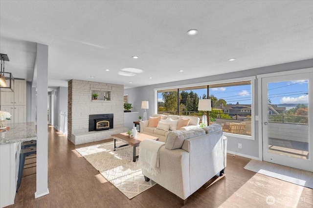 619 8th Ave S, Edmonds, WA 98020 - living area featuring wood finished floors, a stone fireplace, and recessed lighting