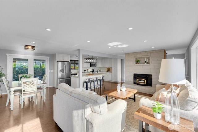 619 8th Ave S, Edmonds, WA 98020 - living area with light wood finished floors, a fireplace, and recessed lighting