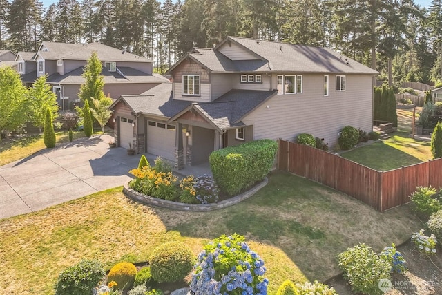 4749 NE Waxwing Ct, Lacey, WA 98516 - view of front facade featuring a garage, concrete driveway, stone siding, and roof with shingles