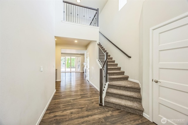 4749 NE Waxwing Ct, Lacey, WA 98516 - stairs featuring wood finished floors and a high ceiling