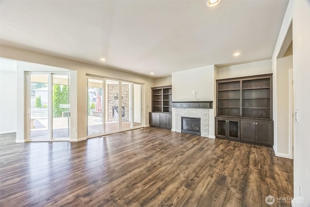 4749 NE Waxwing Ct, Lacey, WA 98516 - unfurnished living room with dark wood finished floors, recessed lighting, and a fireplace