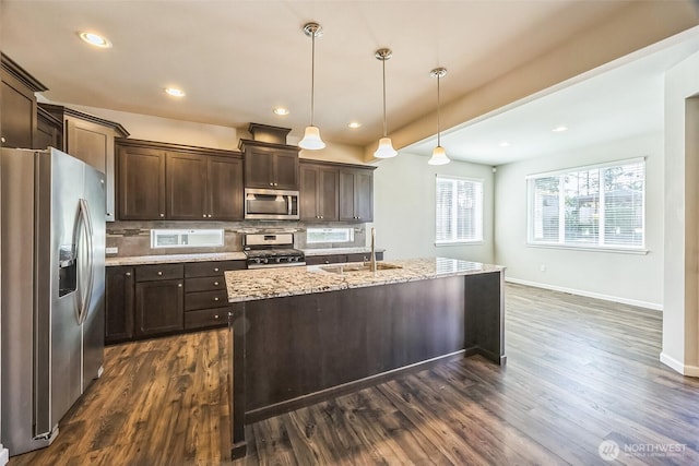 4749 NE Waxwing Ct, Lacey, WA 98516 - kitchen with stainless steel appliances, dark brown cabinets, decorative backsplash, dark wood finished floors, and recessed lighting