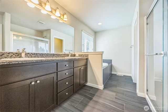 4749 NE Waxwing Ct, Lacey, WA 98516 - bathroom with a shower stall, double vanity, and a garden tub