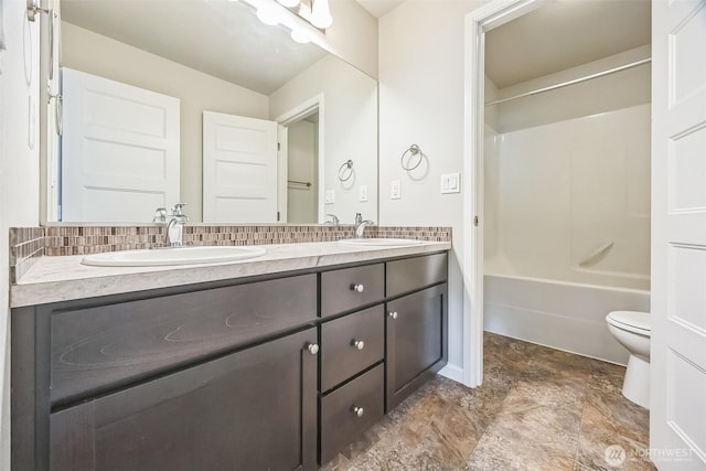 4749 NE Waxwing Ct, Lacey, WA 98516 - bathroom with double vanity, washtub / shower combination, and decorative backsplash