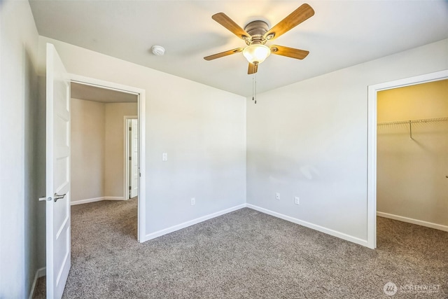 4749 NE Waxwing Ct, Lacey, WA 98516 - unfurnished bedroom featuring carpet flooring, a spacious closet, and a ceiling fan