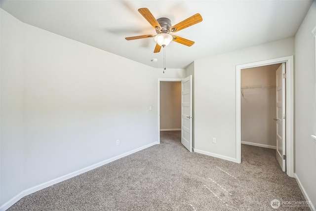 4749 NE Waxwing Ct, Lacey, WA 98516 - unfurnished bedroom with a walk in closet, carpet flooring, and ceiling fan