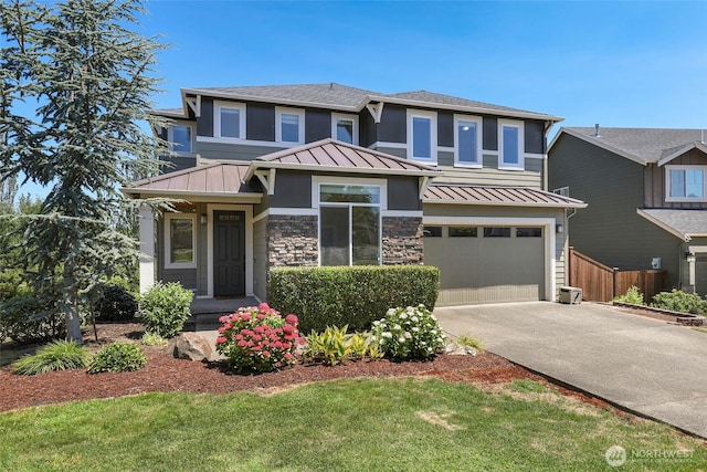6821 9th St E, Fife, WA 98424 - prairie-style house featuring a standing seam roof, a metal roof, a garage, driveway, and a shingled roof