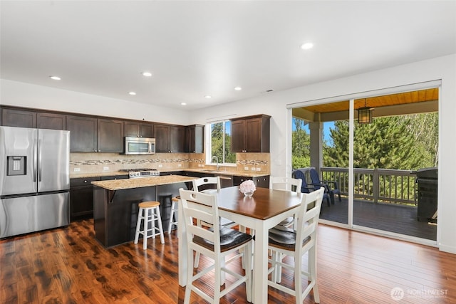 6821 9th St E, Fife, WA 98424 - dining space featuring dark wood-style flooring and recessed lighting