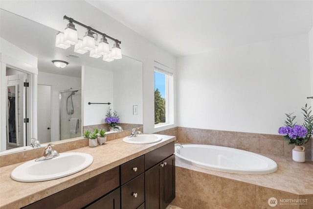 6821 9th St E, Fife, WA 98424 - full bathroom with a stall shower, double vanity, and a garden tub