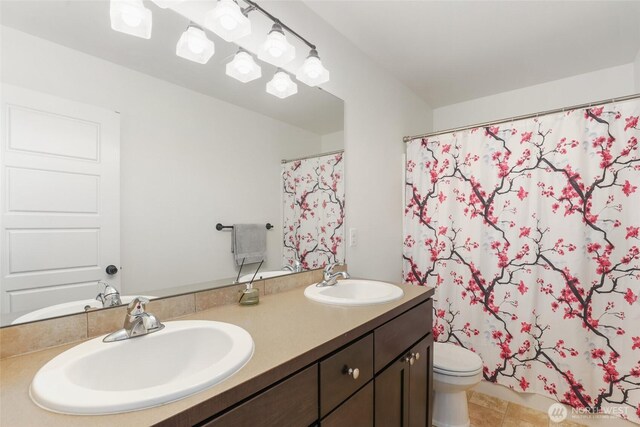 6821 9th St E, Fife, WA 98424 - full bathroom featuring double vanity, a shower with shower curtain, and tile patterned floors