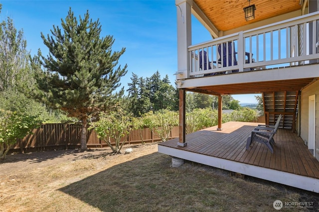 6821 9th St E, Fife, WA 98424 - fenced backyard with a wooden deck and stairs