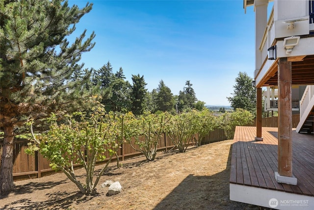 6821 9th St E, Fife, WA 98424 - fenced backyard featuring a wooden deck
