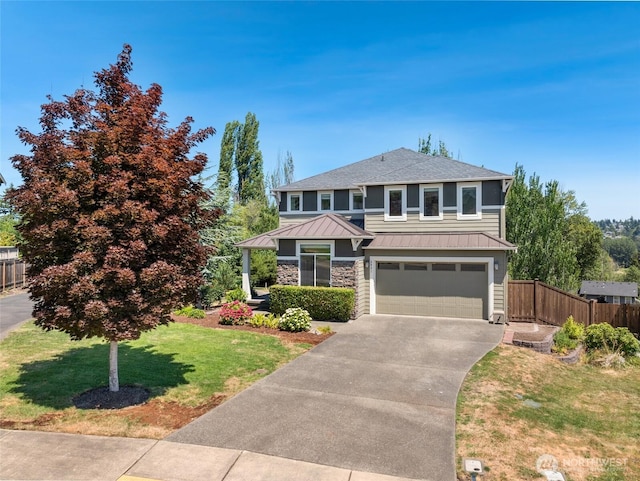 6821 9th St E, Fife, WA 98424 - view of front of house with a standing seam roof, a garage, driveway, a metal roof, and a shingled roof