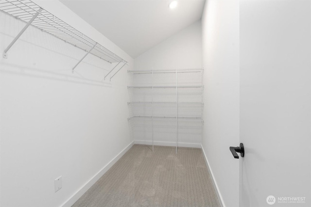 1327 N 185th St Unit A, Shoreline, WA 98133 - walk in closet with carpet floors and vaulted ceiling