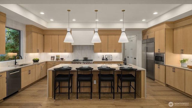 15734 SE 25th St, Bellevue, WA 98008 - kitchen featuring built in appliances, light brown cabinetry, a center island, tasteful backsplash, and recessed lighting
