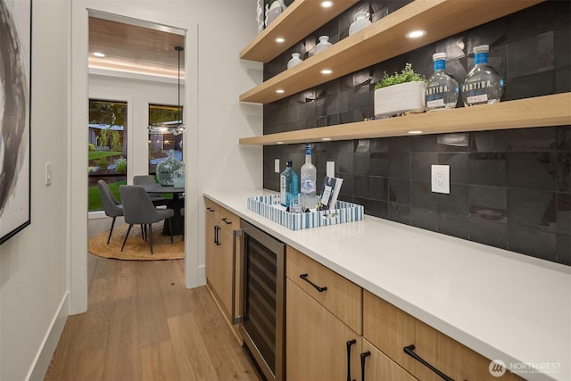 15734 SE 25th St, Bellevue, WA 98008 - indoor dry bar with beverage cooler, light wood-style floors, backsplash, and recessed lighting