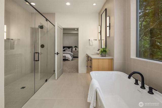 15734 SE 25th St, Bellevue, WA 98008 - ensuite bathroom featuring a tub to relax in, vanity, a shower stall, recessed lighting, and tile patterned flooring