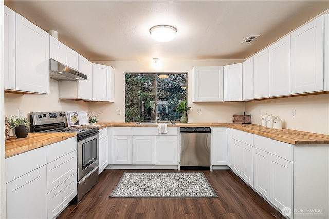 20632 76th Ave W Unit 4, Edmonds, WA 98026 - kitchen with wood counters, stainless steel appliances, ventilation hood, and dark wood finished floors