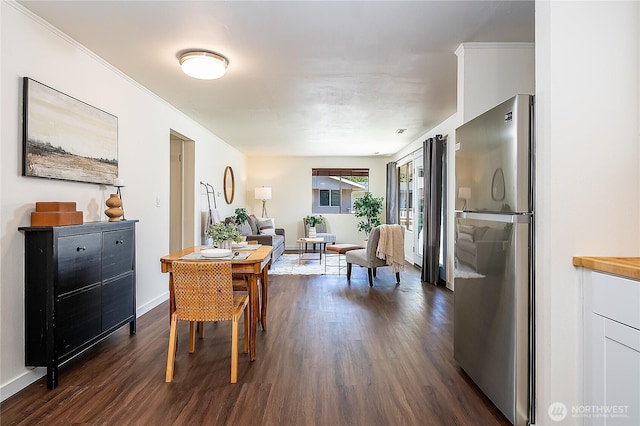 20632 76th Ave W Unit 4, Edmonds, WA 98026 - dining area featuring dark wood finished floors and baseboards