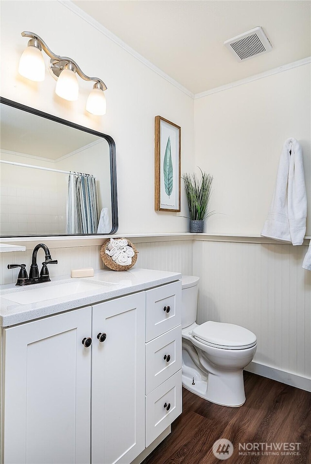 20632 76th Ave W Unit 4, Edmonds, WA 98026 - full bathroom with wood finished floors, vanity, wainscoting, crown molding, and curtained shower