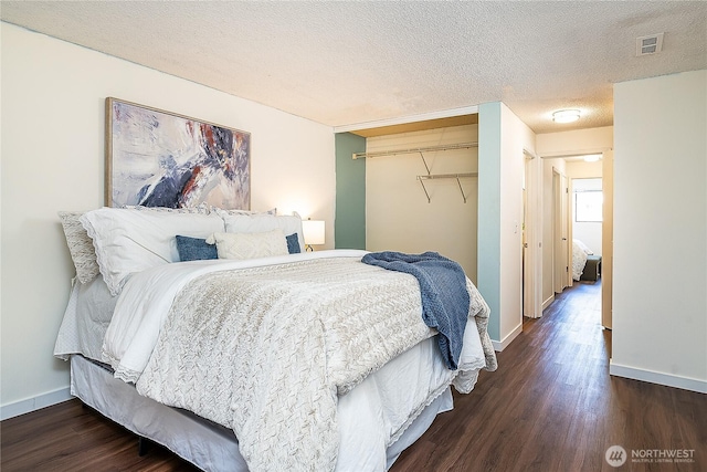 20632 76th Ave W Unit 4, Edmonds, WA 98026 - bedroom with wood finished floors, a closet, and a textured ceiling