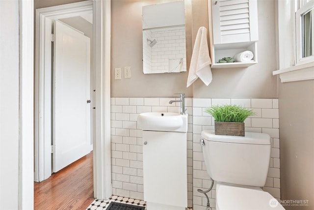 8153 34th Ave SW, Seattle, WA 98126 - bathroom with tile walls, vanity, a wainscoted wall, and wood finished floors