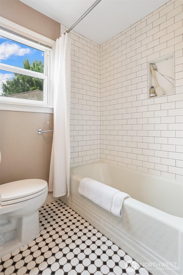 8153 34th Ave SW, Seattle, WA 98126 - bathroom with shower / tub combo and tile patterned flooring