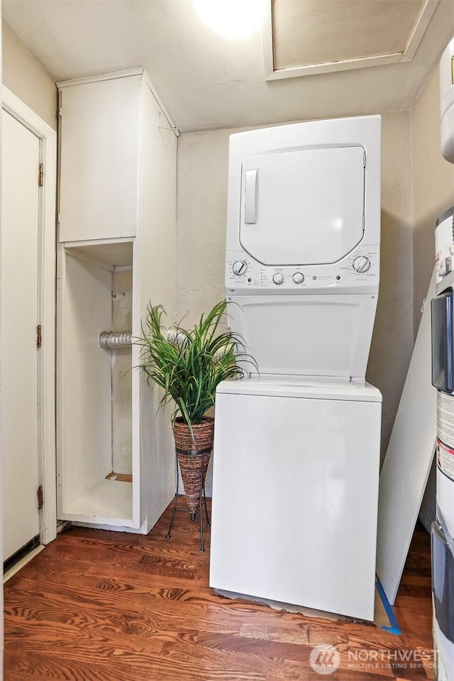 8153 34th Ave SW, Seattle, WA 98126 - laundry room with estacked washer and dryer, attic access, and wood finished floors