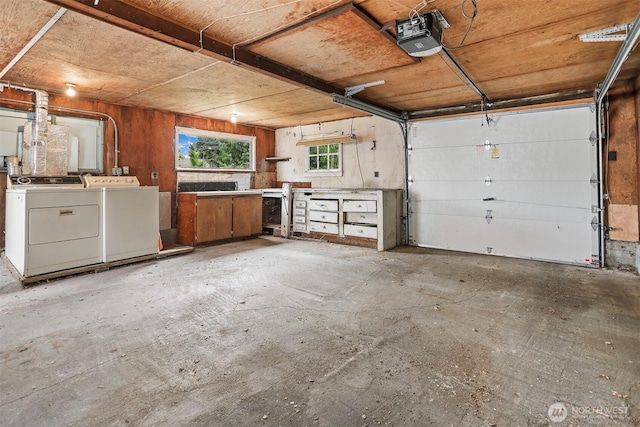 8153 34th Ave SW, Seattle, WA 98126 - garage featuring a garage door opener and separate washer and dryer