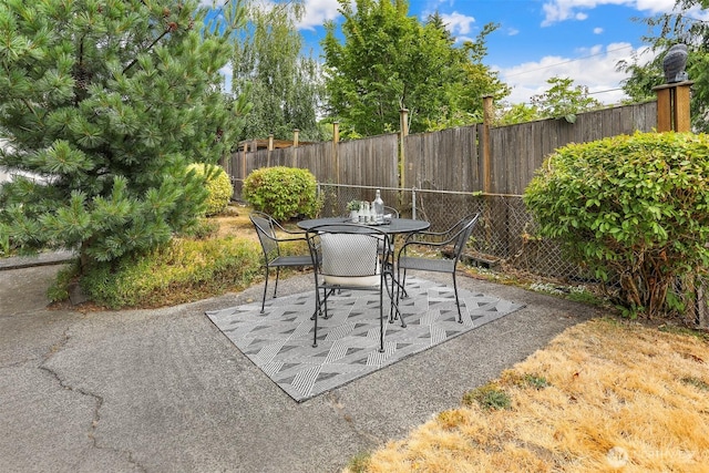 8153 34th Ave SW, Seattle, WA 98126 - fenced backyard with a patio area and outdoor dining area
