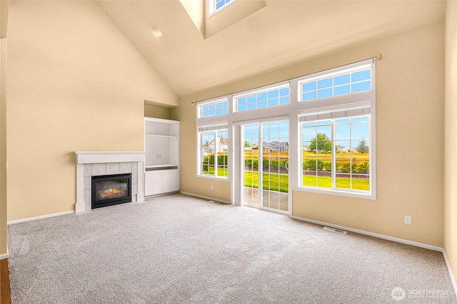 1725 Harrison Pl Unit 104, Lynden, WA 98264 - unfurnished living room featuring a high ceiling, a fireplace, and carpet