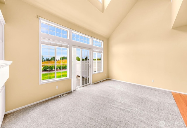 1725 Harrison Pl Unit 104, Lynden, WA 98264 - spare room featuring high vaulted ceiling and carpet flooring