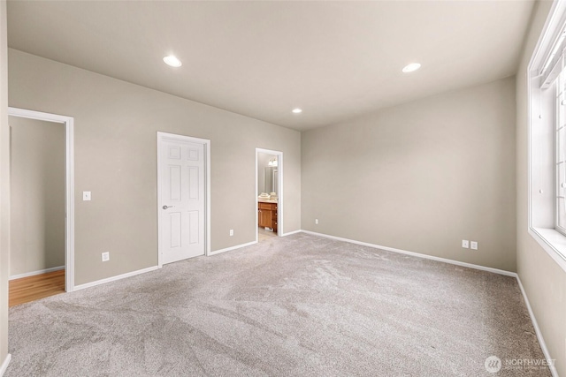 1725 Harrison Pl Unit 104, Lynden, WA 98264 - unfurnished bedroom featuring light colored carpet, recessed lighting, and ensuite bath