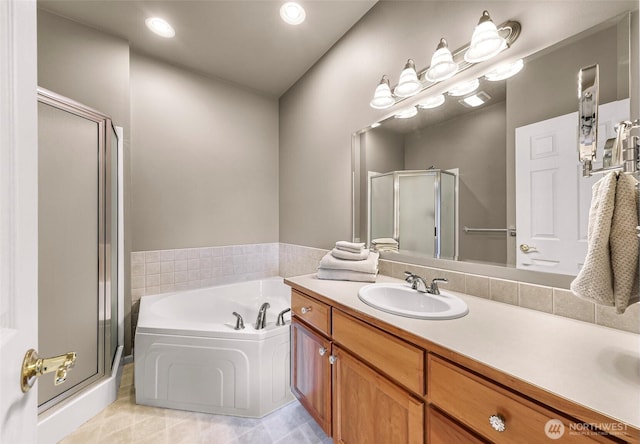 1725 Harrison Pl Unit 104, Lynden, WA 98264 - bathroom featuring a shower stall, vanity, a bath, tile patterned floors, and recessed lighting