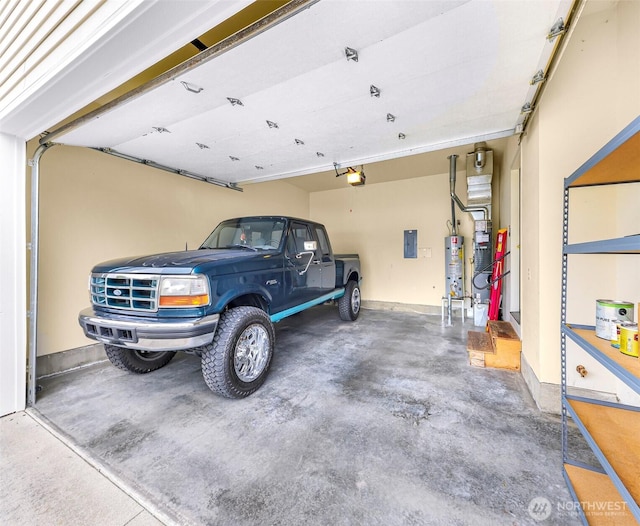 1725 Harrison Pl Unit 104, Lynden, WA 98264 - garage with a garage door opener, electric panel, and water heater