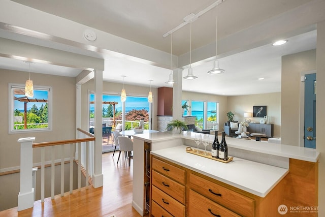 9423 45th Ave SW, Seattle, WA 98136 - kitchen with light wood-style flooring, light countertops, open floor plan, pendant lighting, and recessed lighting