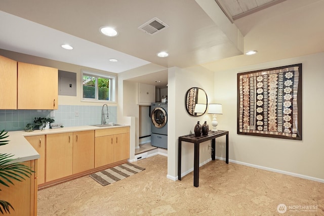 9423 45th Ave SW, Seattle, WA 98136 - kitchen featuring light brown cabinetry, washer / dryer, light countertops, backsplash, and recessed lighting