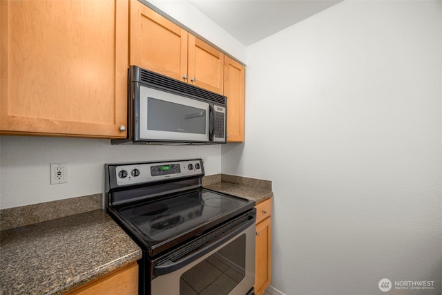 300 10th Ave Unit A310, Seattle, WA 98122 - kitchen featuring appliances with stainless steel finishes and dark countertops