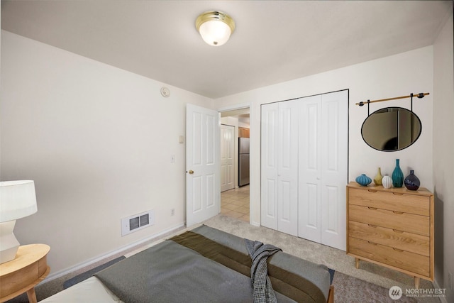 300 10th Ave Unit A310, Seattle, WA 98122 - carpeted bedroom with freestanding refrigerator and a closet